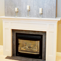 Gas fireplace renovation with white framing